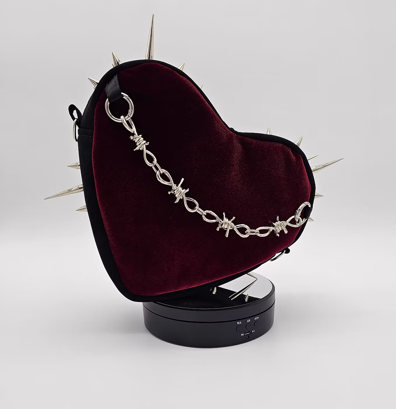 Heart-shaped velvet purse with silver spikes and barbed-wire chain strap